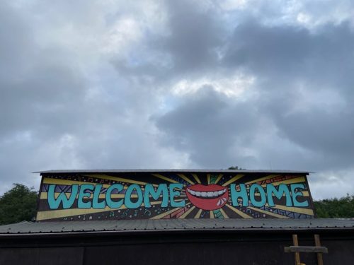 Photo Description: Welcome Home mural on the side of a building leading into the Quiet Valley Ranch campground.